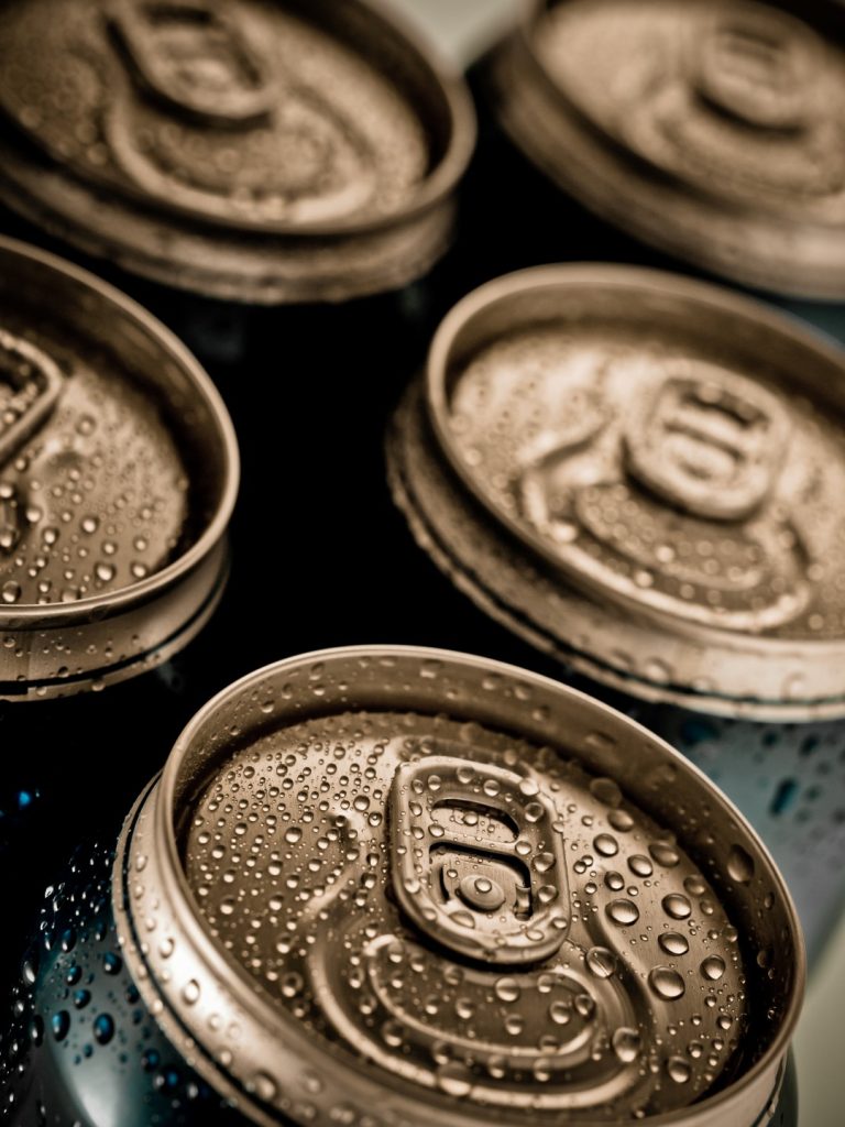 Top part of beer cans, close up view